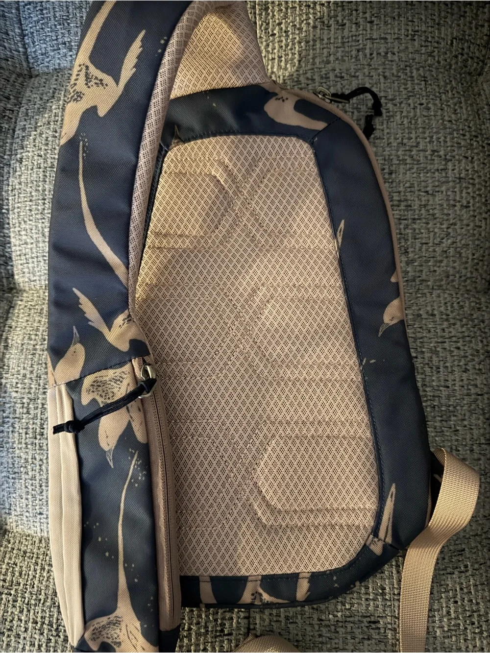Patagonia sling pack in navy blue with tan accents
